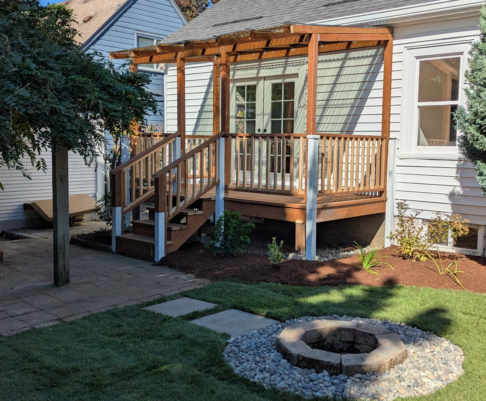 New deck built into the space of an existing deck while retaining original elements